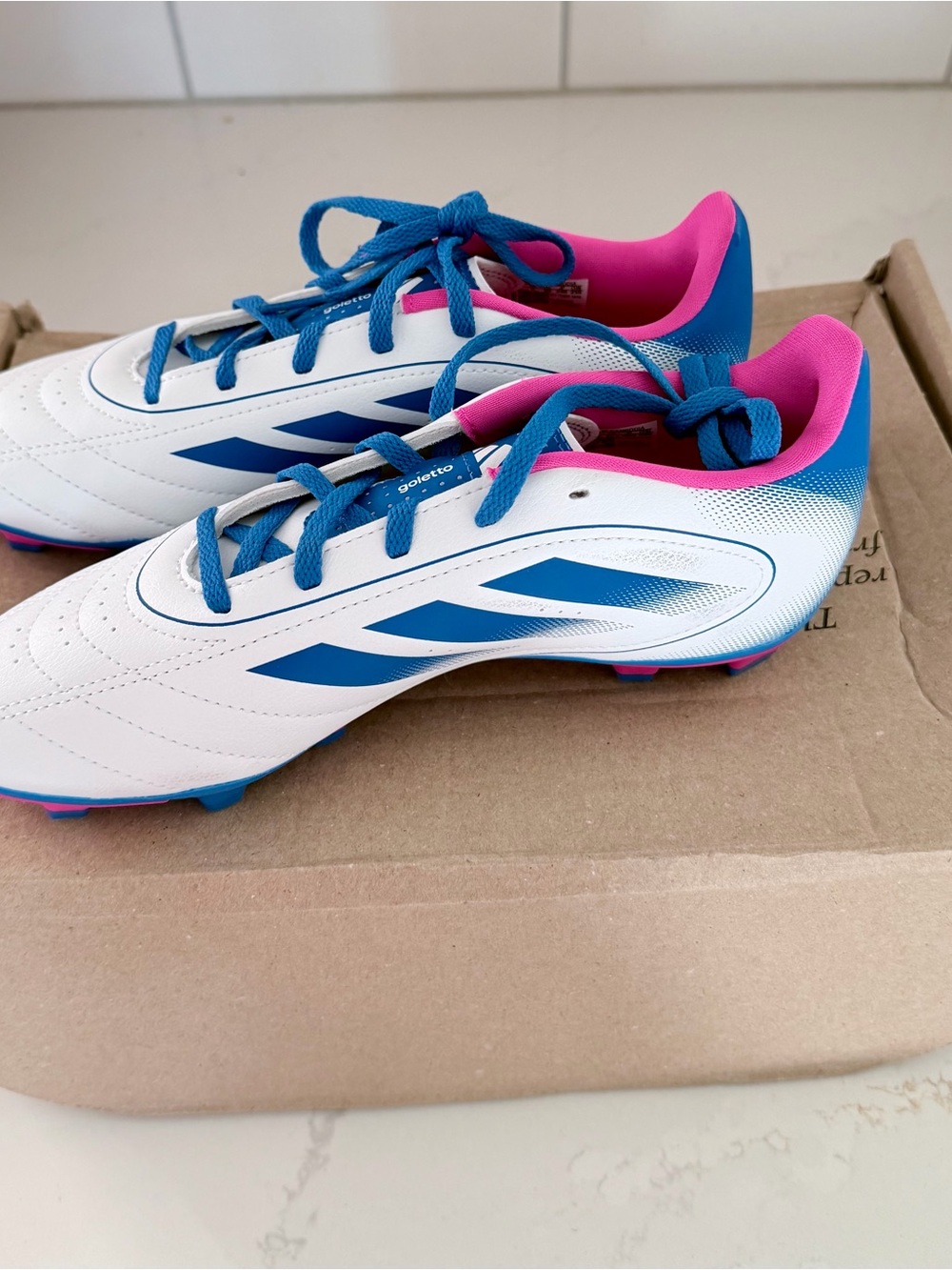 adidas Kids White Soccer Cleats with Blue Accents and Pink Lining